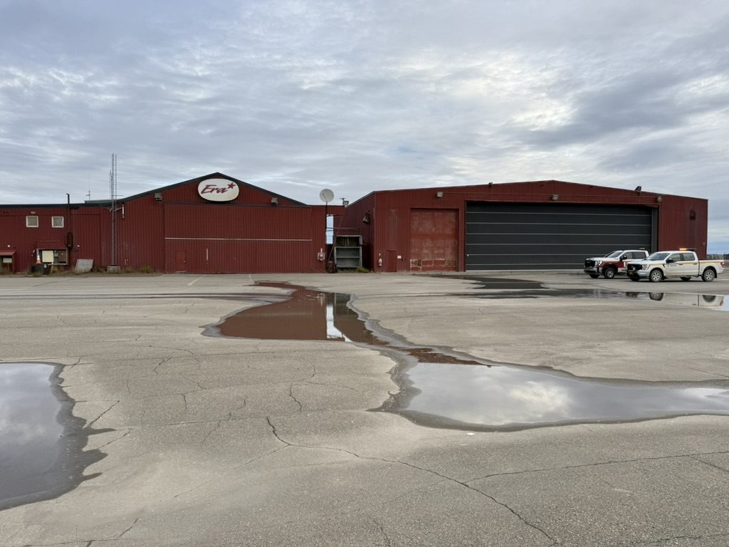 Main Deadhorse hangar exterior with apron parking and crew trucks