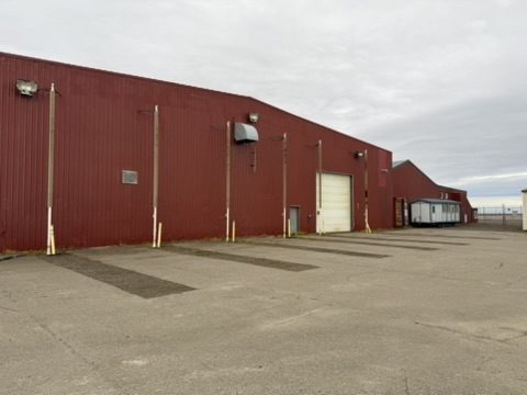 Side elevation of the Deadhorse hangar with personnel door and roll-up bay