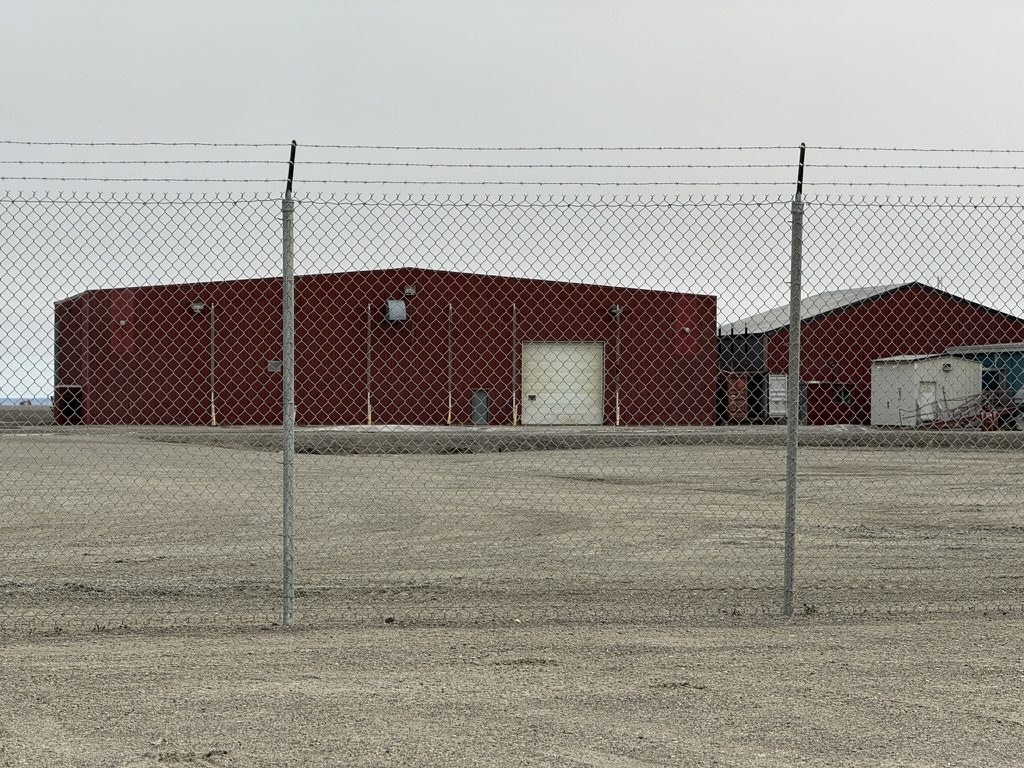 Deadhorse hangar and shop buildings behind the secured airfield fence