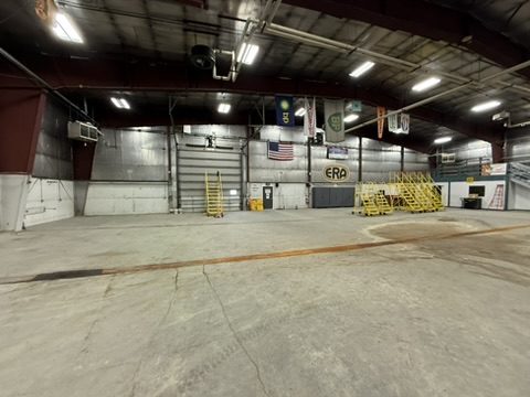 Hangar bay with rolling maintenance stands