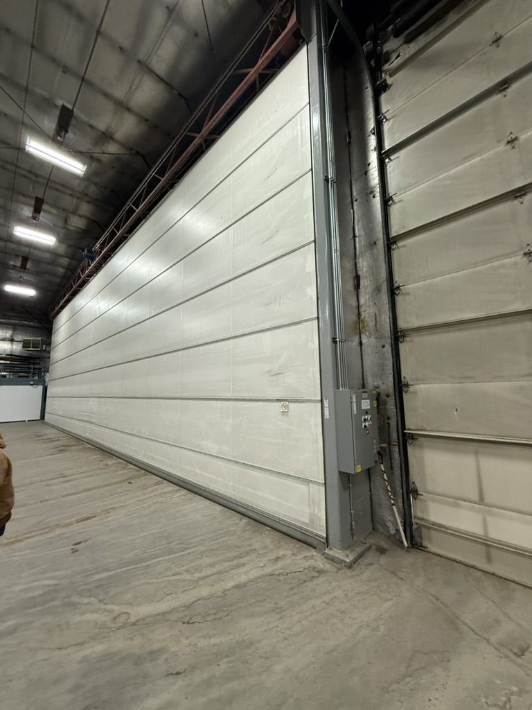 Insulated bi-fold hangar door from inside the bay