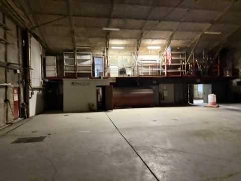 Hangar bay with mezzanine storage above the shop offices