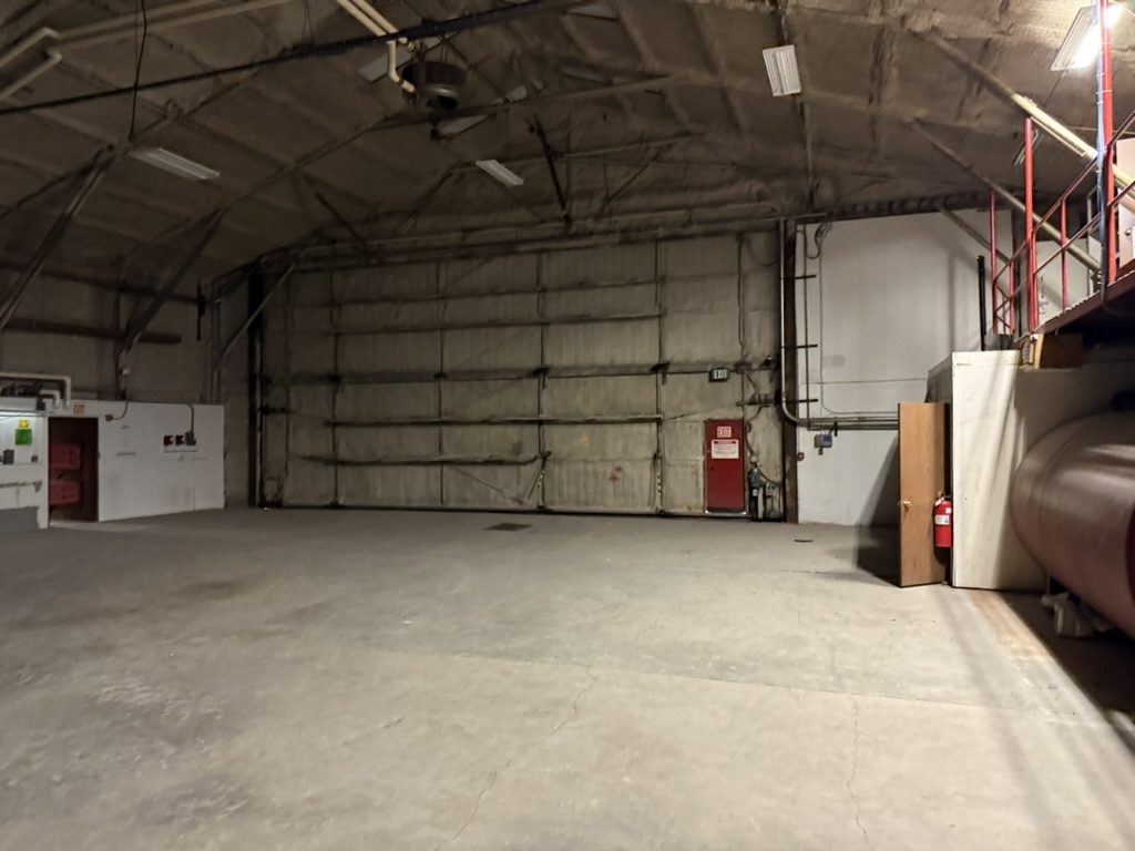 Heated warehouse bay with insulated walls and overhead door