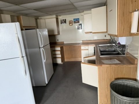 Crew kitchen with full-size refrigerator and prep counters