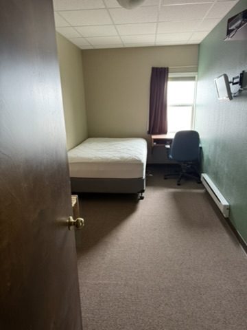 Furnished single sleeping room in the crew quarters