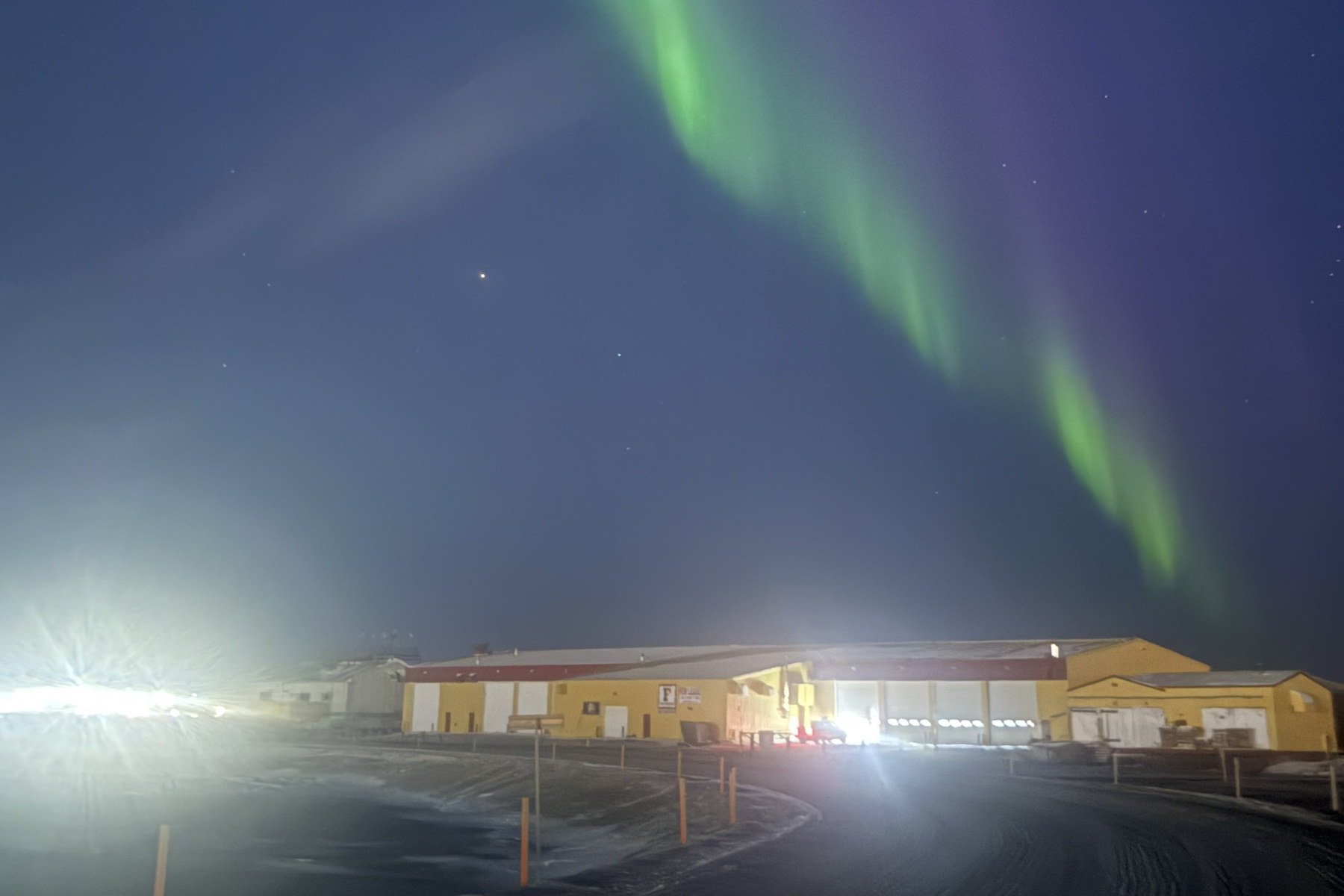 Aurora over the Frontier industrial yard at Prudhoe Bay, Alaska